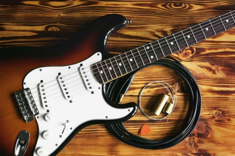 fender guitar with cables and picks
